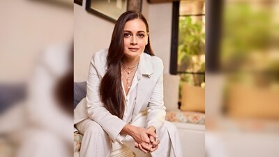 Captured elegantly on a couch, Dia Mirza's ensemble includes a white blazer and matching trousers, styled with a relaxed untucked white shirt. (Instagram/@diamirzaofficial) Captured elegantly on a couch, Dia Mirza's ensemble includes a white blazer and matching trousers, styled with a relaxed untucked white shirt. (Instagram/@diamirzaofficial)