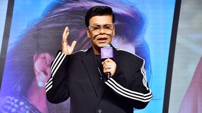 Karan Johar says Shah Rukh Khan has never made him feel any less.
