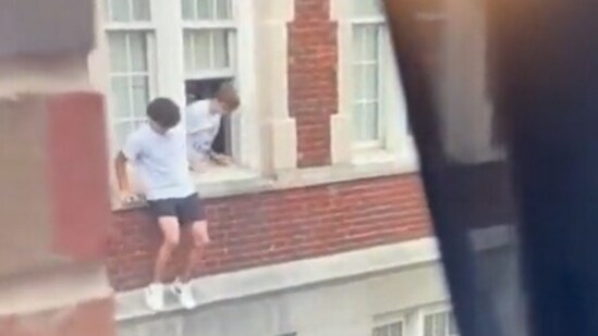 A chilling video shows students jumping out of the windows to escape the shooting (WRAL screenshot)