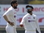 Indian pacer Ishant Sharma (L), captain Virat Kohli (R)