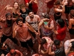 Spain La Tomatina Festival: Revelers react during the annual "La Tomatina" food fight festival in Bunol, Spain.