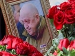 A view shows a framed photo of Russian mercenary chief Yevgeny Prigozhin at his grave at the Porokhovskoye cemetery in Saint Petersburg, Russia.