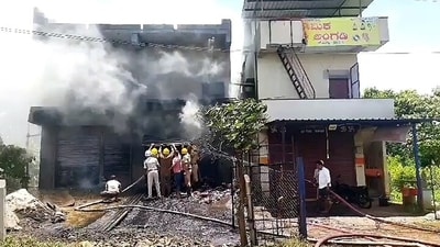 Firefighters douse a fire that broke out at a firecracker shop, in Aladakatti village of Haveri on Tuesday. (ANI Photo) Firefighters douse a fire that broke out at a firecracker shop, in Aladakatti village of Haveri on Tuesday. (ANI Photo)