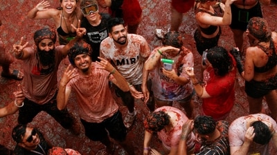 Spain La Tomatina Festival: Revelers react during the annual "La Tomatina" food fight festival in Bunol, Spain. (Reuters)