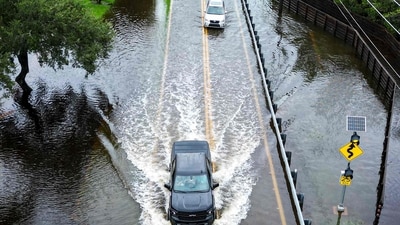 Hurricane Idalia: In this aerial view, vehicles attempt to travel on a flooded road in Tampa, Florida. (AFP)