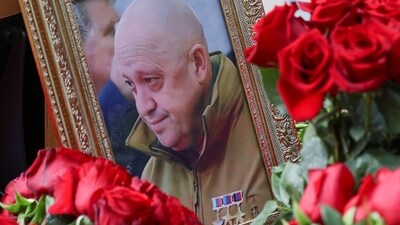 A view shows a framed photo of Russian mercenary chief Yevgeny Prigozhin at his grave at the Porokhovskoye cemetery in Saint Petersburg, Russia. (Reuters)