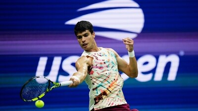 Carlos Alcaraz, of Spain, returns a shot to Dominik Koepfer, of Germany, during the first round of the U.S. Open (AP) Carlos Alcaraz, of Spain, returns a shot to Dominik Koepfer, of Germany, during the first round of the U.S. Open (AP)
