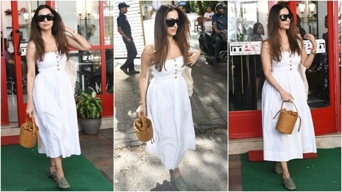 Malaika Arora stuns in a white midi dress during an outing in Mumbai. (HT Photo/Varinder Chawla)