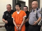 Tailei Qi, the graduate student suspected in the fatal shooting of a University of North Carolina at Chapel Hill faculty member, center, makes his first appearance at the Orange County Courthouse in Hillsborough, N.C., Tuesday, Aug. 29, 2023. Qi has been charged by the UNC Police Department with first-degree murder and possession of a weapon on educational property, both felony charges. (Source: AP)