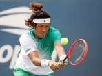 Zhizhen Zhang of China returns a shot Zhizhen Zhang of China returns a shot