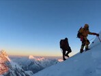 Mountain climbers on their way to the peak.