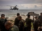 A Philippine Air Force Black Hawk helicopter lands on Thursday, June 29, 2023, at Mavulis Island, Batanes province, northern Philippines. A Philippine Air Force Black Hawk helicopter lands on Thursday, June 29, 2023, at Mavulis Island, Batanes province, northern Philippines.