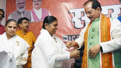 Brahma Kumaris tie Rakhi to leader of Opposition and BJP leader Vijay Sinha on the occasion of Raksha Bandhan at BJP office in Patna, Bihar. (HT Photo/Santosh Kumar)