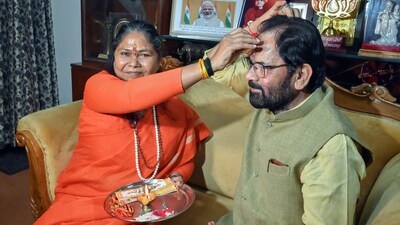 Union Minister of State for Consumer Affairs Sadhvi Niranjan Jyoti applies tilak on the forehead of Bharatiya Janata Party (BJP) leader Mukhtar Abbas Naqvi as they celebrate the Raksha Bandhan at her residence in New Delhi. (ANI) Union Minister of State for Consumer Affairs Sadhvi Niranjan Jyoti applies tilak on the forehead of Bharatiya Janata Party (BJP) leader Mukhtar Abbas Naqvi as they celebrate the Raksha Bandhan at her residence in New Delhi. (ANI)