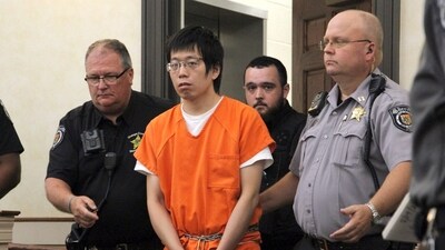 Tailei Qi, the graduate student suspected in the fatal shooting of a University of North Carolina at Chapel Hill faculty member, center, makes his first appearance at the Orange County Courthouse in Hillsborough, N.C., Tuesday, Aug. 29, 2023. Qi has been charged by the UNC Police Department with first-degree murder and possession of a weapon on educational property, both felony charges. (Source: AP) (AP)