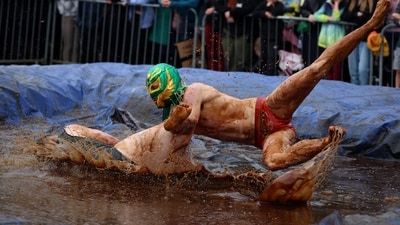 Wrestlers Joe Blashill and El Bisto in the World Gravy Wrestling Championships. (REUTERS)