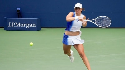 Iga Swiatek, of Poland, returns a shot to Daria Saville, of Australia, during the second round of the U.S. Open. (AP) Iga Swiatek, of Poland, returns a shot to Daria Saville, of Australia, during the second round of the U.S. Open. (AP)
