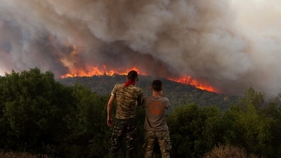 Greece Wildfires: Flames burn a forest during wildfires near the village of Sykorrahi, near Alexandroupolis town, in the northeastern Evros region, Greece. (AP) Greece Wildfires: Flames burn a forest during wildfires near the village of Sykorrahi, near Alexandroupolis town, in the northeastern Evros region, Greece. (AP)