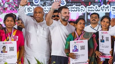 Congress leader Rahul Gandhi and party President Mallikarjun Kharge during the inauguration of the Karnataka Government's Gruha Laxmi scheme. (PTI) Congress leader Rahul Gandhi and party President Mallikarjun Kharge during the inauguration of the Karnataka Government's Gruha Laxmi scheme. (PTI)