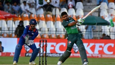 Pakistan's Babar Azam, right, plays a shot as Nepal's Aasif Sheikh watches (AP) Pakistan's Babar Azam, right, plays a shot as Nepal's Aasif Sheikh watches (AP)