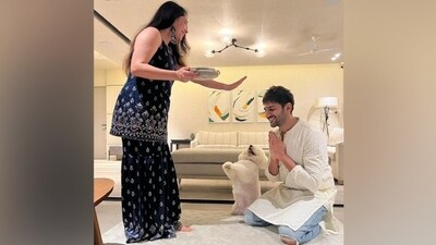 Kartik Aaryan shared an adorable photo from his Rakhi celebrations with his sister with the caption, "Katori mithai ke liye kar rahi, main aashirwad ke liye (Katori is bowing for sweets, I am doing it for blessings). Happy Rakshabandhan."&nbsp; (Instagram)