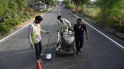 Road repair work going on at Naurangpur-Tauru road due to G20 4th Sherpa Meeting near Bar-Gujjar village, in Gurugram on Thursday. (Parveen Kumar/HT) Road repair work going on at Naurangpur-Tauru road due to G20 4th Sherpa Meeting near Bar-Gujjar village, in Gurugram on Thursday. (Parveen Kumar/HT)