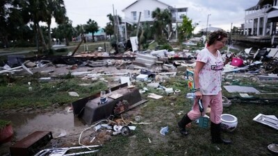 Jewell Baggett walks amidst debris strewn across the yard where her mother’s home had stood, as she searches for anything salvageable from the trailer home her grandfather had acquired in 1973 and built multiple additions on to over the decades, in Horseshoe Beach, Fla., after the passage of Hurricane Idalia, Wednesday, Aug. 30, 2023. (Source: AP) (AP) Jewell Baggett walks amidst debris strewn across the yard where her mother’s home had stood, as she searches for anything salvageable from the trailer home her grandfather had acquired in 1973 and built multiple additions on to over the decades, in Horseshoe Beach, Fla., after the passage of Hurricane Idalia, Wednesday, Aug. 30, 2023. (Source: AP) (AP)