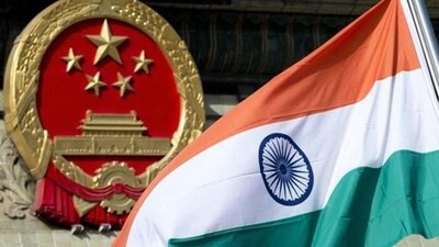 A file photo of an Indian flag next to the Chinese national emblem during a welcome ceremony for visiting Indian officials outside the Great Hall of the People in Beijing. (AP)