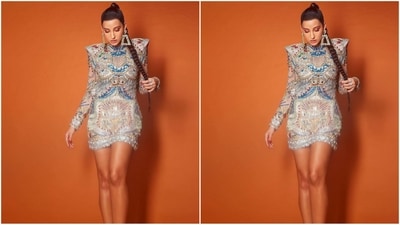 Playing muse to fashion designer Falguni Shane Peacock, she was dressed in a full-sleeved minidress featuring a padded shoulder and intricate sequin embroidery work all over adorned with multicoloured embellishments. (Instagram/@norafatehi) Playing muse to fashion designer Falguni Shane Peacock, she was dressed in a full-sleeved minidress featuring a padded shoulder and intricate sequin embroidery work all over adorned with multicoloured embellishments. (Instagram/@norafatehi)