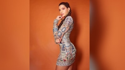 Assisted by hair stylist Madhav Trehan, Nora styled her lush locks into a long, braided high ponytail that perfectly complemented her glamorous look. (Instagram/@norafatehi) Assisted by hair stylist Madhav Trehan, Nora styled her lush locks into a long, braided high ponytail that perfectly complemented her glamorous look. (Instagram/@norafatehi)