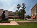 A statue of Mahatma Gandhi sits between the old and new Parliament House buildings. A statue of Mahatma Gandhi sits between the old and new Parliament House buildings.