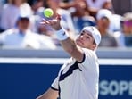John Isner of the United States serves against Michael Mmoh at the US Open