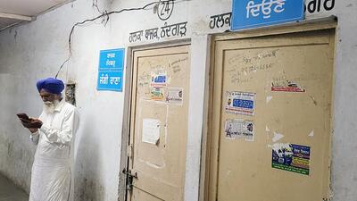 A man waiting outside a locked patwari room in Patwar Bhawan in Bathinda on Friday. (Sanjeev Kumar/HT) A man waiting outside a locked patwari room in Patwar Bhawan in Bathinda on Friday. (Sanjeev Kumar/HT)