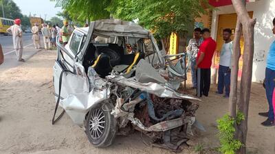 The mangled remains of the car that rammed into a stationary tractor trailer near Badalgarh village. (HT Photo) The mangled remains of the car that rammed into a stationary tractor trailer near Badalgarh village. (HT Photo)