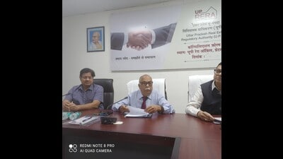 The new chairman of UP-Rera Sanjay Bhoosareddy (middle) during a meeting. (HT Photo) The new chairman of UP-Rera Sanjay Bhoosareddy (middle) during a meeting. (HT Photo)