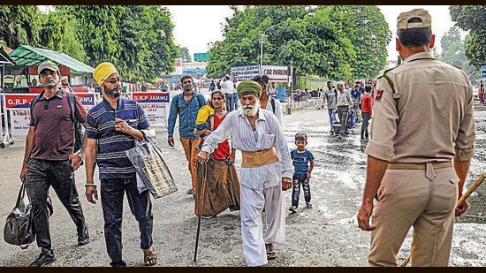 Commuters forced to walk to at the Jammu railway station during a strike by All Jammu and Kashmir Transport Welfare Association (AJKTWA) workers on Friday. (PTI)