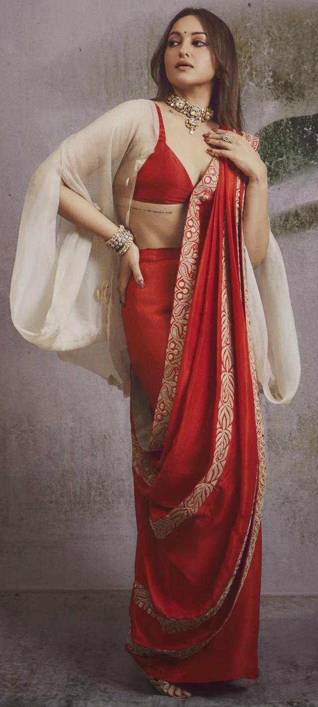 Sonakshi Sinha in a red wide-legged pants, bralette blouse, saree set with a cape (Photo: Instagram) Sonakshi Sinha in a red wide-legged pants, bralette blouse, saree set with a cape (Photo: Instagram)