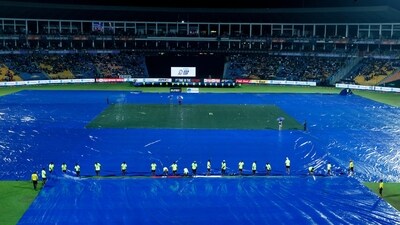 Rain came on just as the players left the field after the Indian innings. While it looked like everything was primed for players to return to the field at one point with minimal reduction in overs. they ran back once the rain got heavier again, (BCCI Twitter) Rain came on just as the players left the field after the Indian innings. While it looked like everything was primed for players to return to the field at one point with minimal reduction in overs. they ran back once the rain got heavier again, (BCCI Twitter)