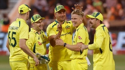 Australia's Nathan Ellis celebrates taking a wicket with teammates (REUTERS)