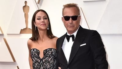 FILE - Christine Baumgartner, left, and Kevin Costner arrive at the Oscars, March 27, 2022, at the Dolby Theatre in Los Angeles. Costner and Baumgartner, his wife of nearly 19 years, are divorcing, a representative for the actor said Tuesday, May 2, 2023. (Photo by Jordan Strauss/Invision/AP, File) (Jordan Strauss/Invision/AP) FILE - Christine Baumgartner, left, and Kevin Costner arrive at the Oscars, March 27, 2022, at the Dolby Theatre in Los Angeles. Costner and Baumgartner, his wife of nearly 19 years, are divorcing, a representative for the actor said Tuesday, May 2, 2023. (Photo by Jordan Strauss/Invision/AP, File) (Jordan Strauss/Invision/AP)