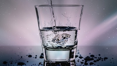 A representation image showing a glass pouring water. (Pixababy)