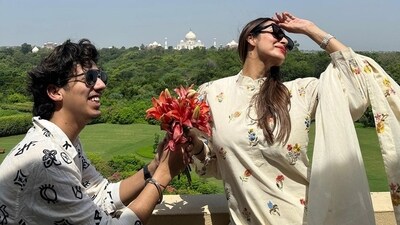 Malaika Arora seems to be in Agra for a photo shoot. She shared a candid picture with her hairstylist as he sat on a knee and offered her a bunch of flowers. “Decisions decisions” Malaika joked on her Instagram Stories. Malaika Arora seems to be in Agra for a photo shoot. She shared a candid picture with her hairstylist as he sat on a knee and offered her a bunch of flowers. “Decisions decisions” Malaika joked on her Instagram Stories. 