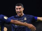 Nassr's Portuguese forward #07 Cristiano Ronaldo (R) celebrates after scoring a goal during the Saudi Pro League football match between Al-Nassr and Al-Hazem Nassr's Portuguese forward #07 Cristiano Ronaldo (R) celebrates after scoring a goal during the Saudi Pro League football match between Al-Nassr and Al-Hazem