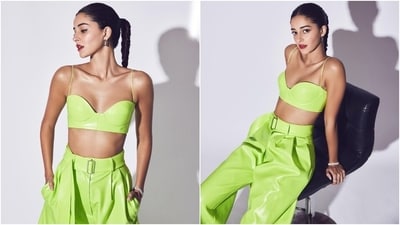 Ananya accessorised the ensemble with black high-heeled boots, a chain-link bracelet, rings, and hoop earrings. Lastly, she chose nude eye shadow, bold red lip shade, mascara on the lashes, blushed cheeks, beaming highlighter, pulled-back braided ponytail, and darkened brows for the glam picks. (Instagram) Ananya accessorised the ensemble with black high-heeled boots, a chain-link bracelet, rings, and hoop earrings. Lastly, she chose nude eye shadow, bold red lip shade, mascara on the lashes, blushed cheeks, beaming highlighter, pulled-back braided ponytail, and darkened brows for the glam picks. (Instagram)