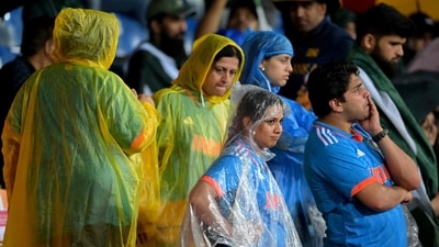 Fans wait out a rain delay during the Asia Cup 2023 (AFP) Fans wait out a rain delay during the Asia Cup 2023 (AFP)