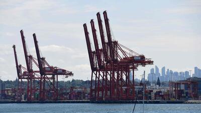 Cranes and containers are seen at the Port Metro Vancouver, in Vancouver, Canada. (AFP)