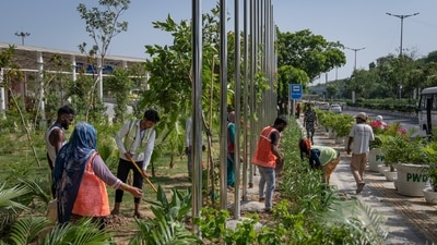 This photo shows the municipality workers preparing the sidewalk outside the main venue for the G20 Summit in New Delhi. Both the G20 tracks, as mentioned previously, have working groups for various themes to deliberate on agendas such as green development, climate finance, inclusive growth, digital economy, public infrastructure, etc. (AP)