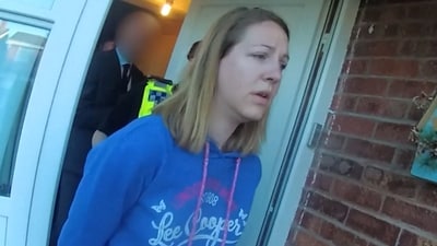 A handout image taken from police bodycam footage released by Cheshire Constabulary police force in Manchester on August 17, 2023, shows the nurse Lucy Letby being arrested at home in Chester on July 3, 2018 (Photo by Cheshire Constabulary / AFP) (AFP)