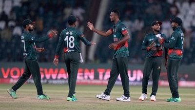Shoriful Islam celebrates with teammates after taking the wicket during the Asia Cup cricket match between Bangladesh and Afghanistan in Lahore (AP)