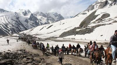 Pilgrims on way to Amarnath Yatra on their mules against backdrop of the Himalayas. (HT File) Pilgrims on way to Amarnath Yatra on their mules against backdrop of the Himalayas. (HT File)